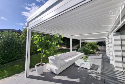 NEW-BUILD, ENERGY-EFFICIENT FAMILY HOME WITH A FOUR-CAR GARAGE, BORDERING NATURE